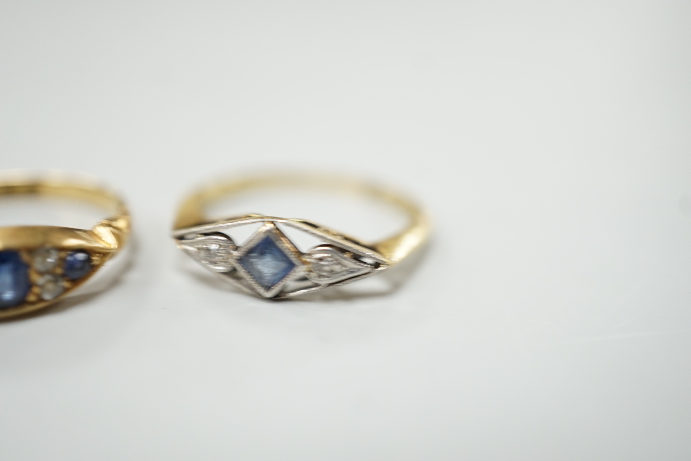 Two early 20th century 18ct, sapphire and diamond set rings, including Edwardian seven stone, size L and K/L